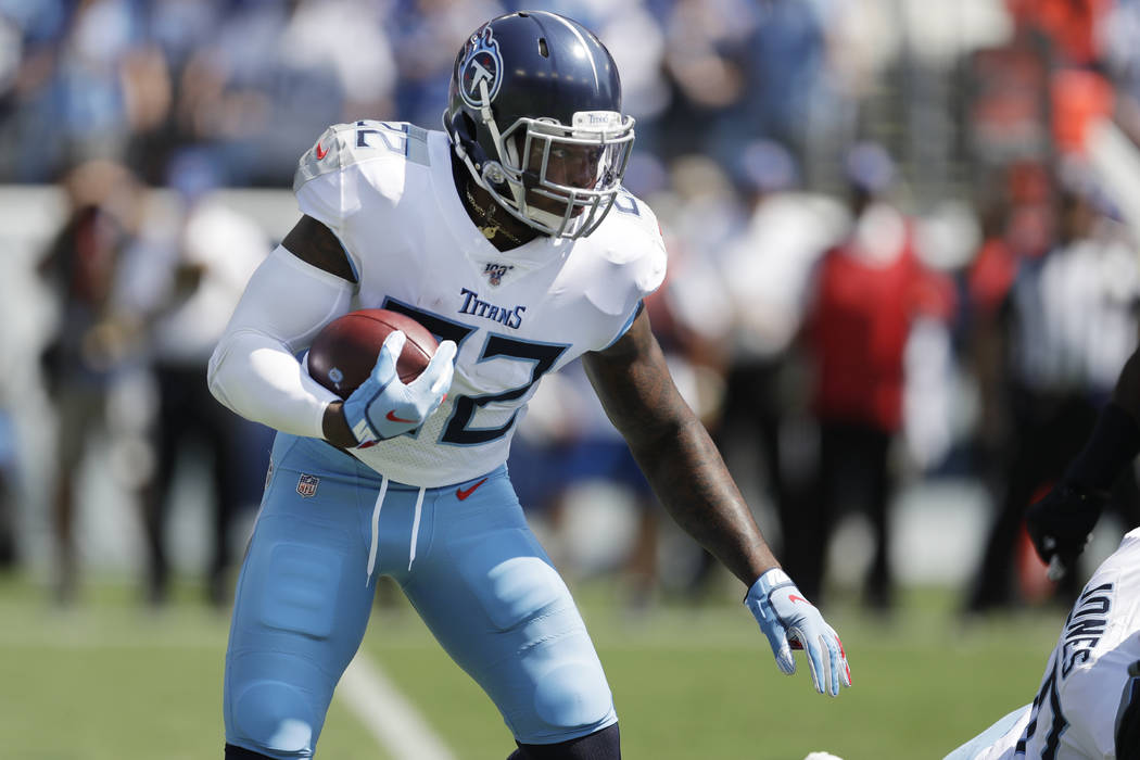 Tennessee Titans running back Derrick Henry carries the ball against the Indianapolis Colts in ...