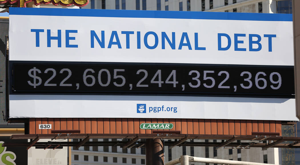 A billboard depicting rising national debt is seen on Las Vegas Boulevard directly across from ...