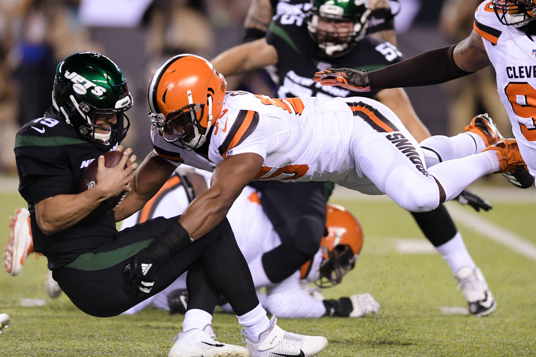 In this Sept. 16, 2019, file photo, Cleveland Browns' Myles Garrett (95) sacks New York Jets' T ...