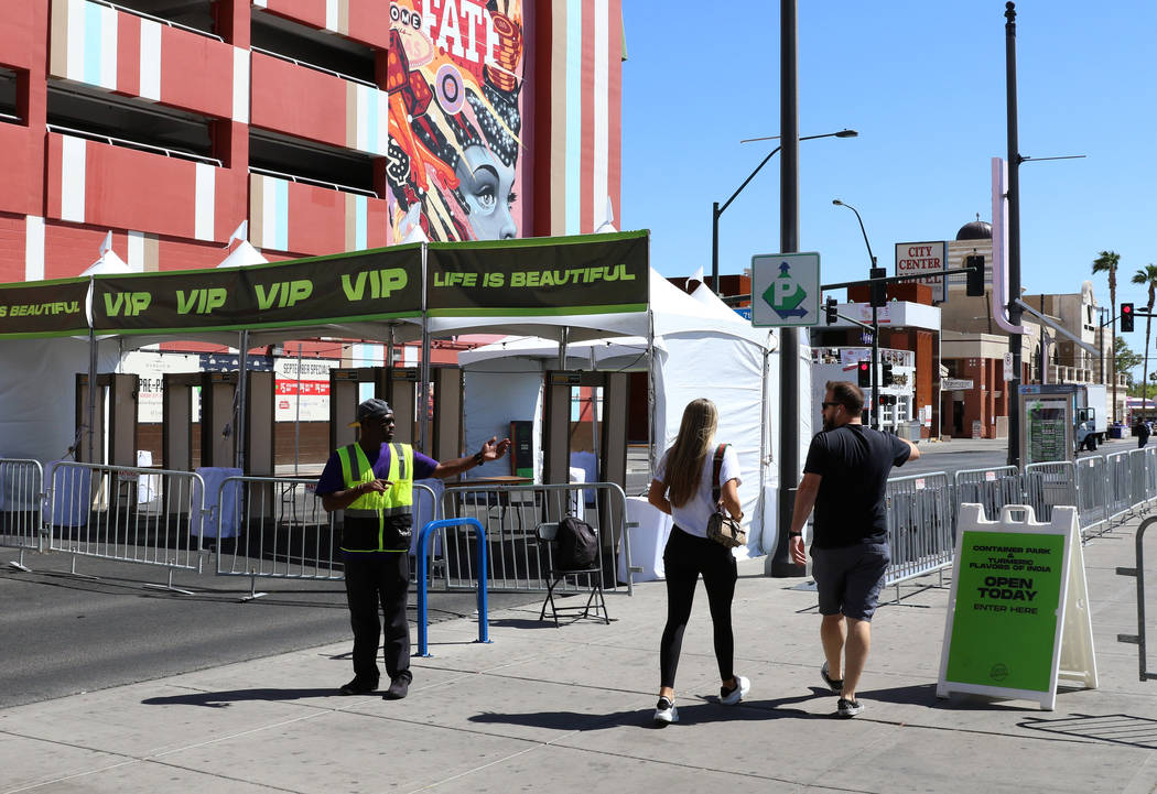 A security guard stops pedestrians as Fremont Street is closed for pedestrian and motor vehicle ...