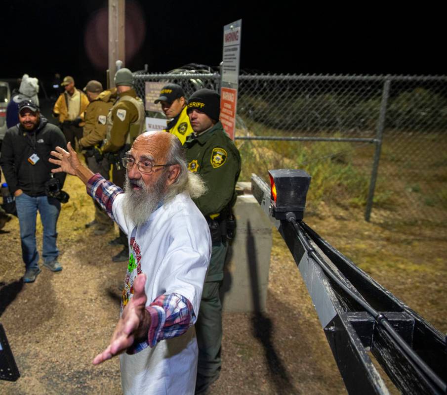 Jody Pendarvis of Bowman, S.C., addresses the crowd standing near security personnel outside th ...