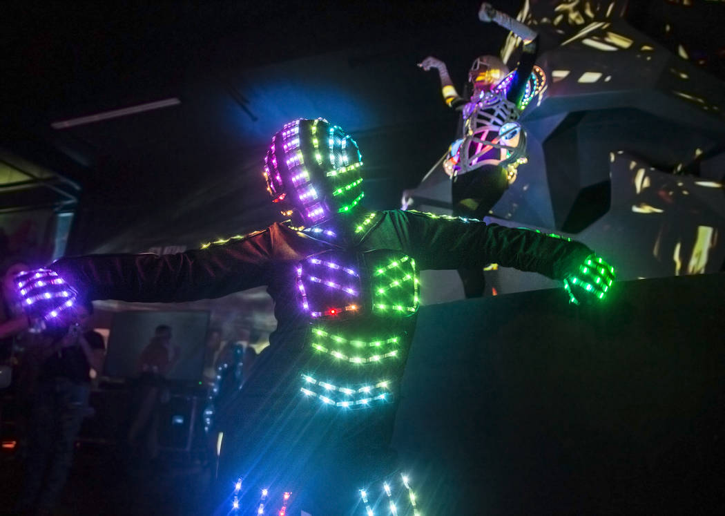 Alien-themed dancers entertain the crowd during a pre-party for Storm Area 51 on Thursday, Sept ...