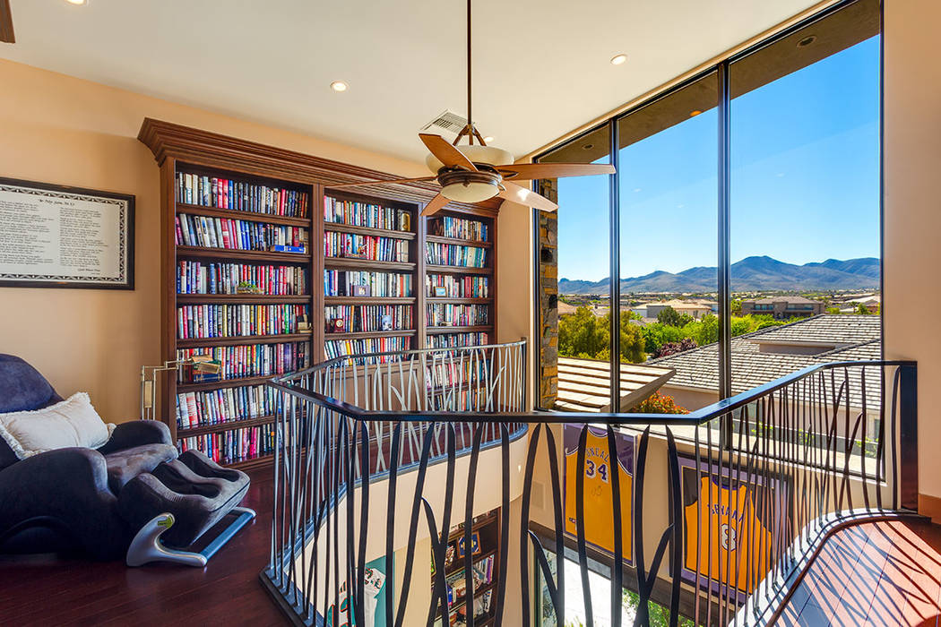 Ivan Sher The home features a two-story library with a reading loft.