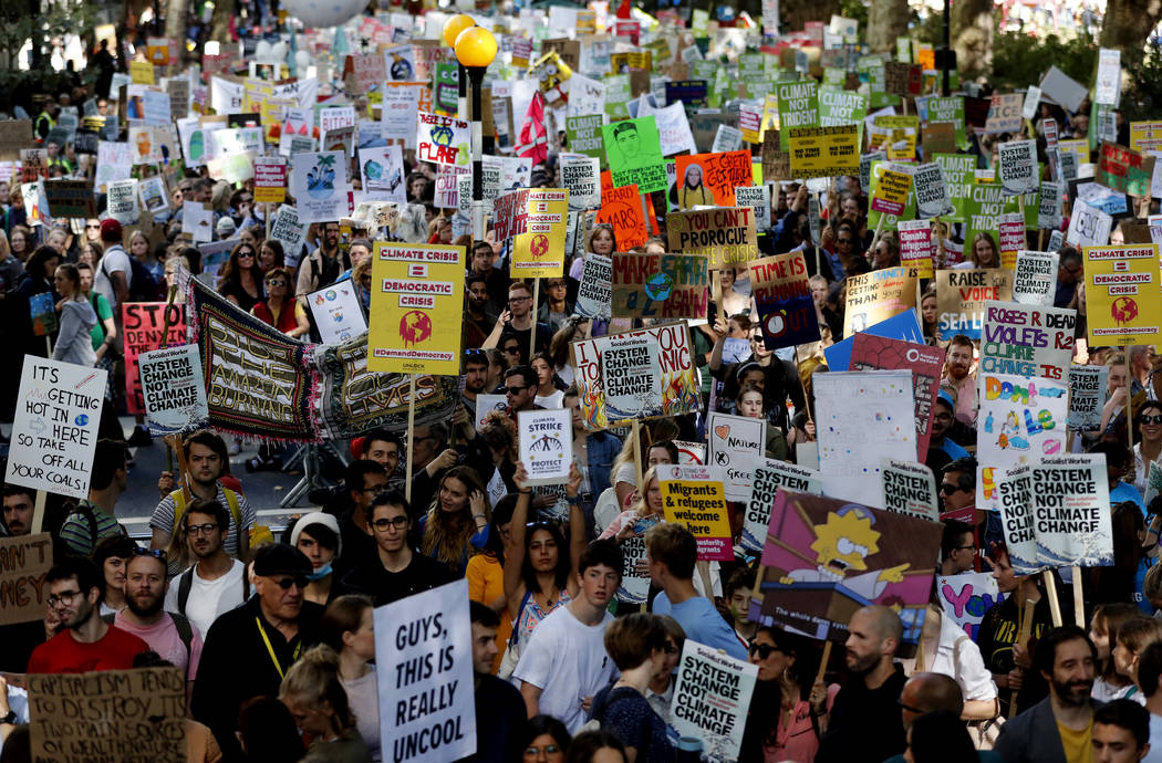 Climate protesters demonstrate in London, Friday, Sept. 20, 2019. Protesters around the world j ...