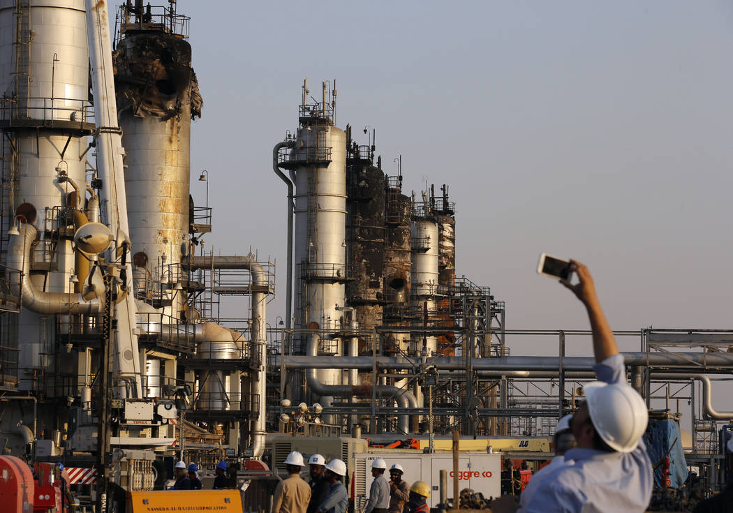 During a trip organized by Saudi information ministry, a cameraman films Aramco's oil processin ...