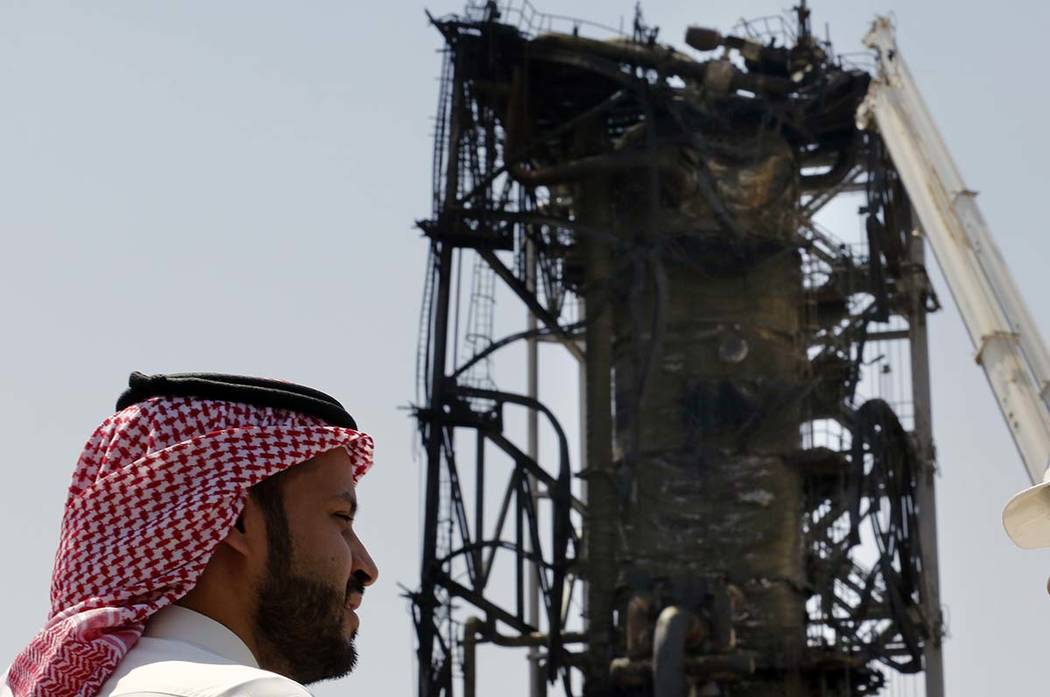 In this photo opportunity during a trip organized by Saudi information ministry, a man watches ...