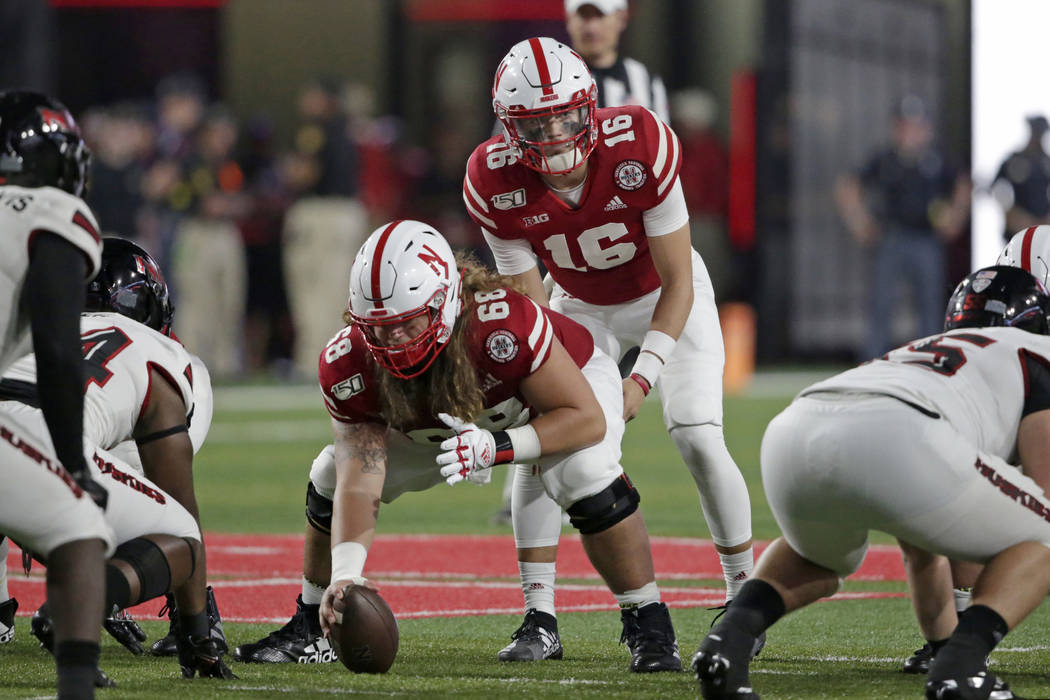 Nebraska quarterback Noah Vedral (16) stands behind offensive lineman Will Farniok (68) at the ...