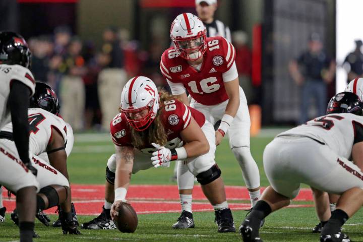 Nebraska quarterback Noah Vedral (16) stands behind offensive lineman Will Farniok (68) at the ...