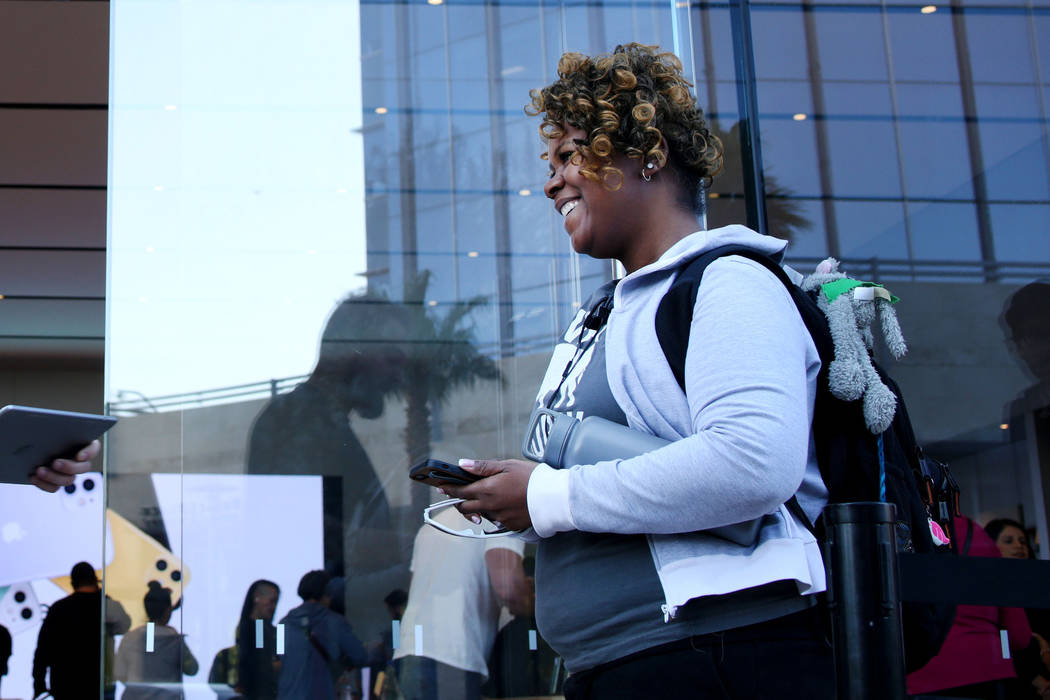 Las Vegas local Kenni Vogrich checks in to purchase her preordered iPhone 11 during the release ...