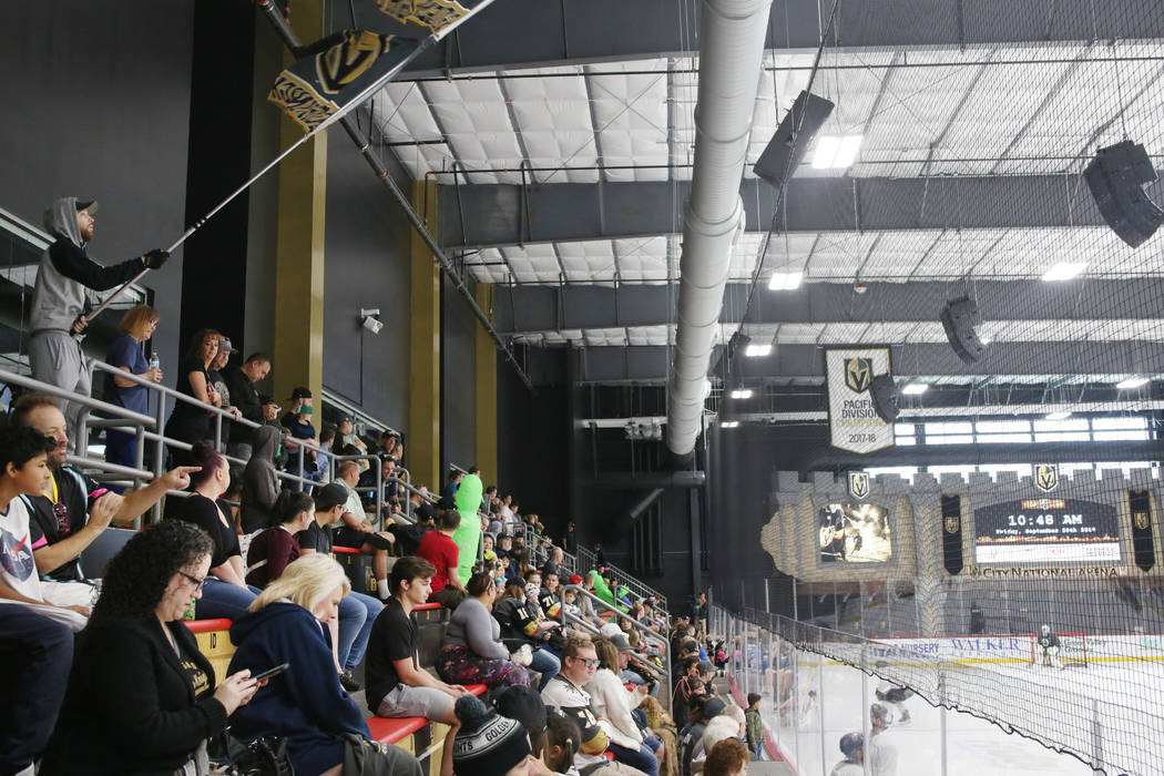 A crowd watches the Golden Knights practice during an alien costume contest at City National Ar ...