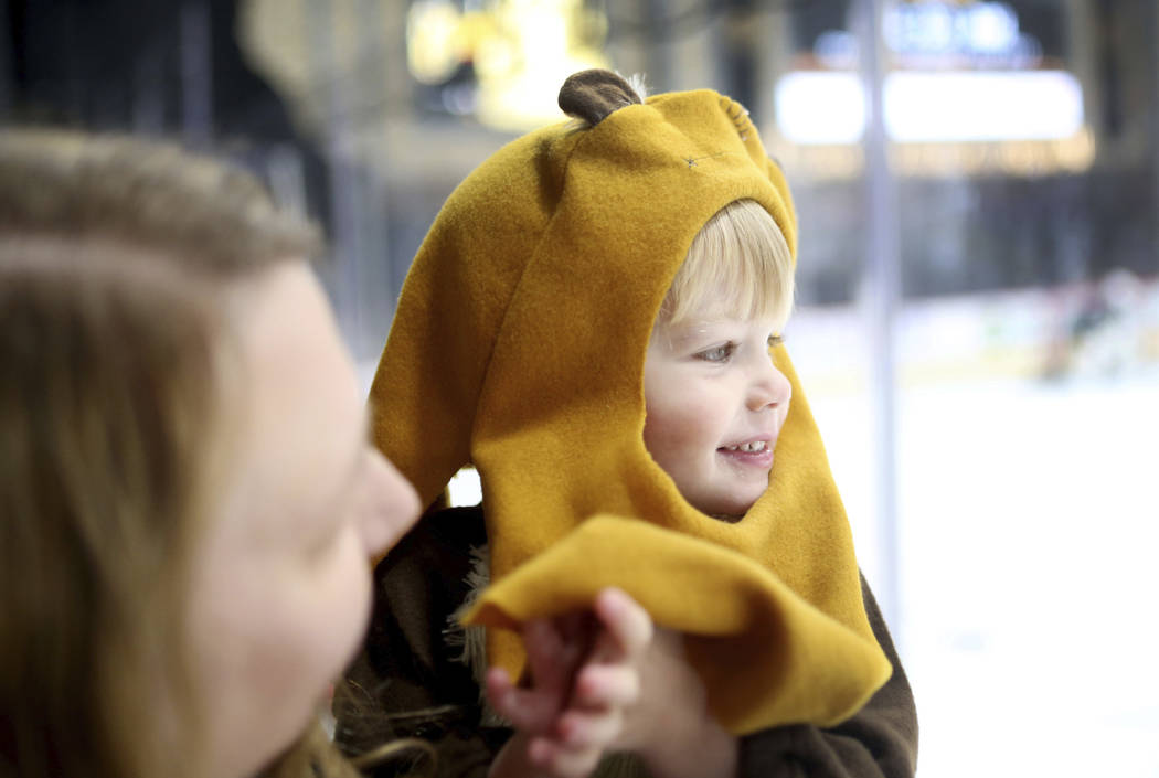 Las Vegas local Sarah Twitty holds her son Jacob Twitty, 3, while they watch the Golden Knights ...