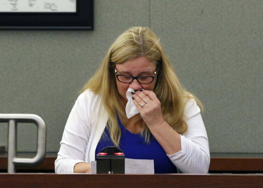 Katherine Bockhorst, a granddaughter of murder victim 86-year-old Helen Sabraw, weeps as she re ...