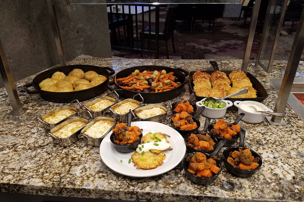 Clockwise from front left, noodle kugel, potato knishes, roasted root vegetables, potato latkes ...