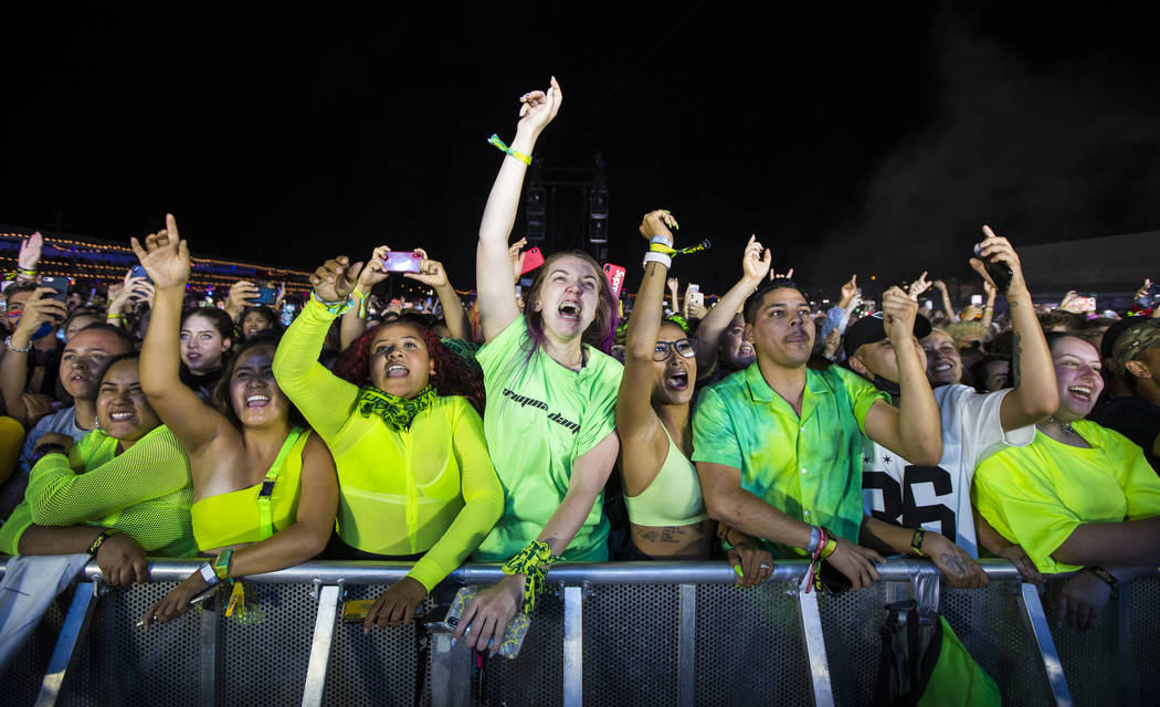 Fans react as Billie Eilish, not pictured, performs at the downtown stage during the first day ...