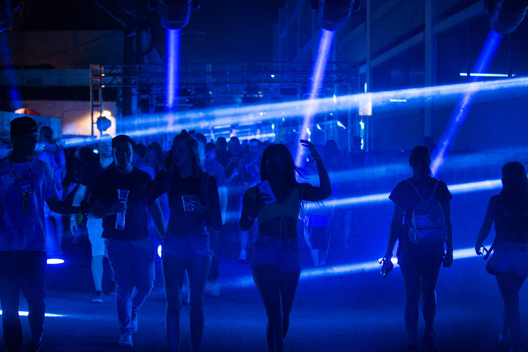 Festivalgoers make their way to the downtown stage during the first day of Life is Beautiful fe ...