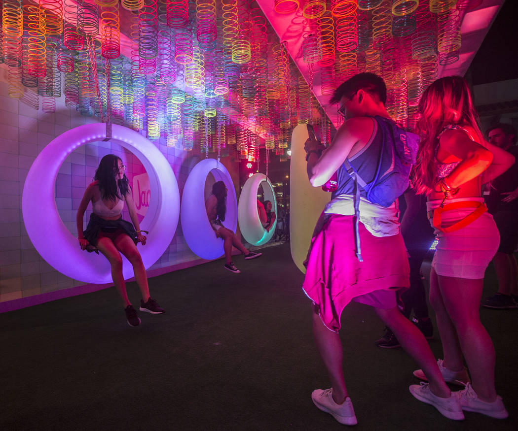 Festivalgoers pose for photos at Jack's Playground during the first day of Life is Beautiful on ...