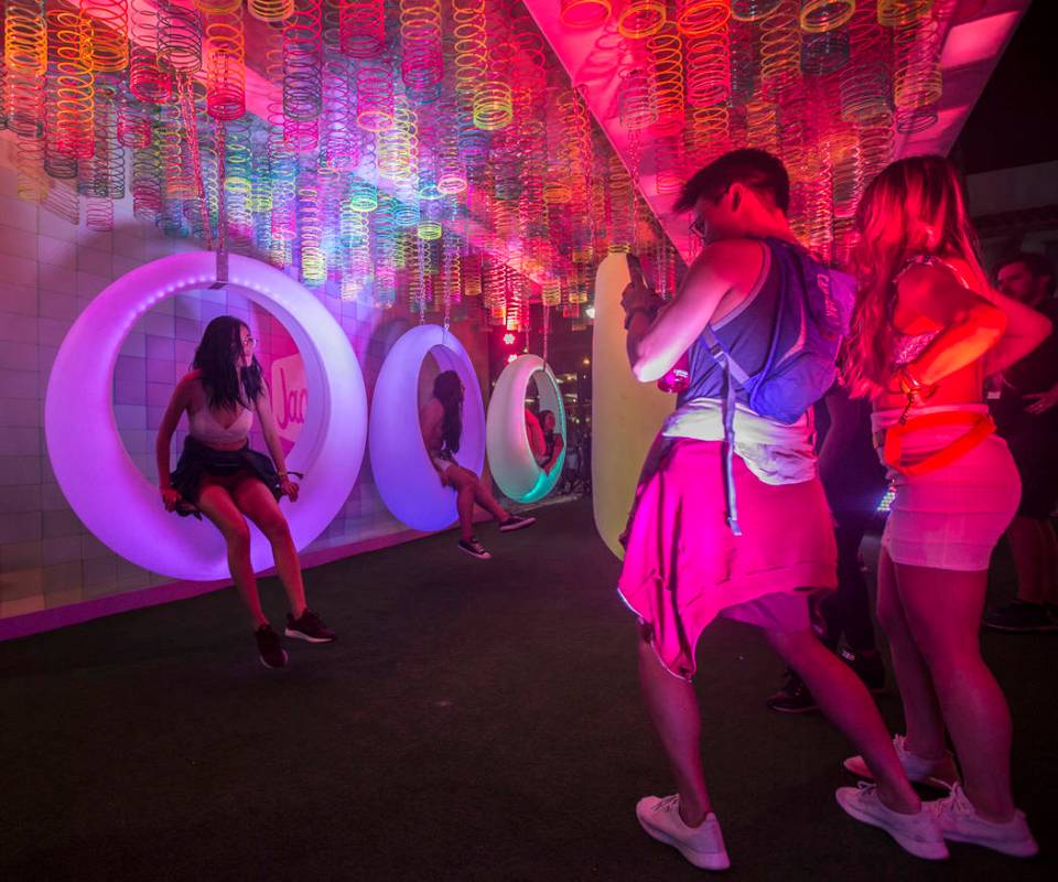 Festivalgoers pose for photos at Jack's Playground during the first day of Life is Beautiful on ...