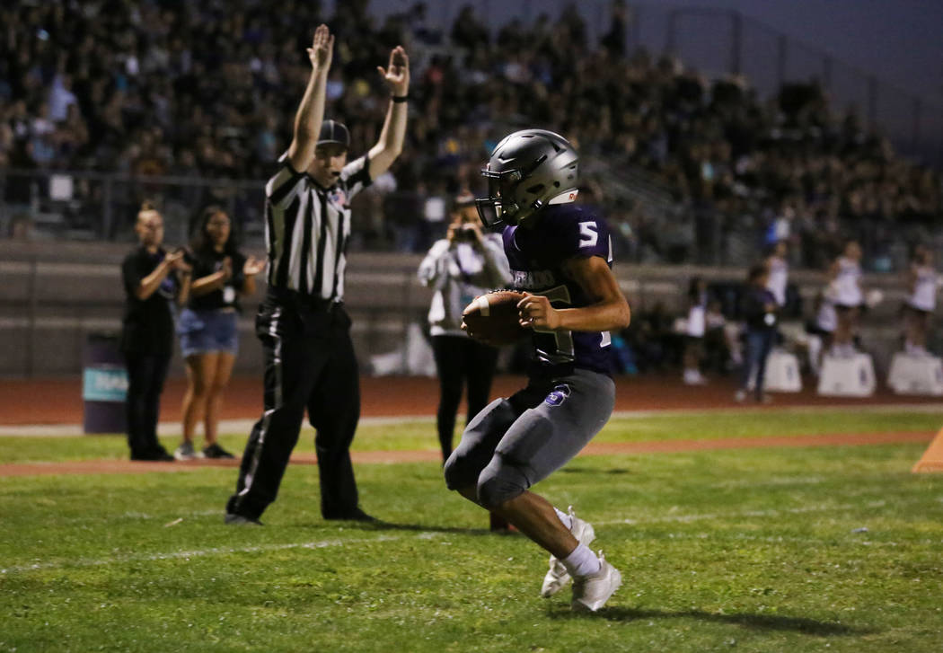 Silverado High's Jeremy Alipio (25) celebrates his touchdown against Durango High during the fi ...