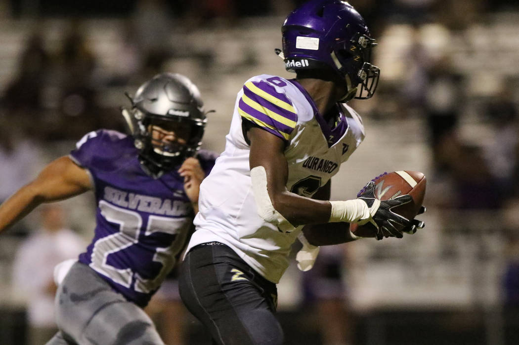 Durango High's Michael Hayword (6) runs with the ball for a touchdown as Silverado's High's run ...