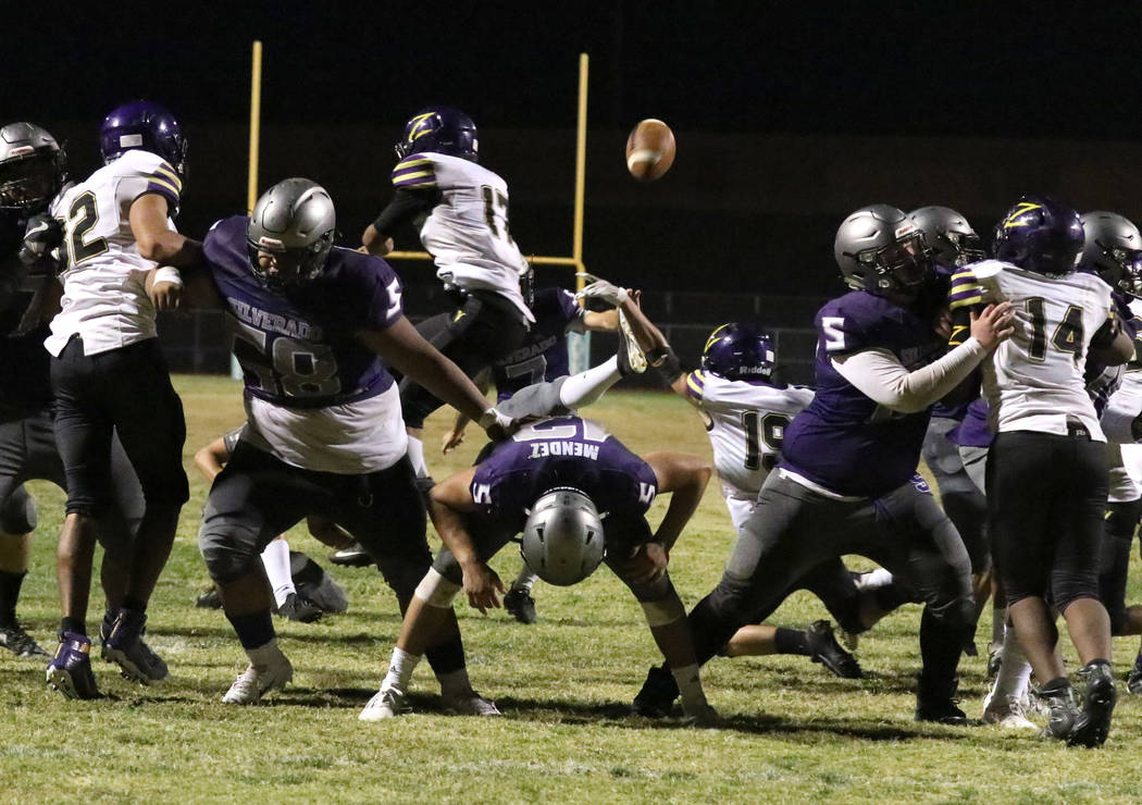 Silverado High's kicker Michael Darin (7) has his field goal kick blocked by Durango High's Tyl ...