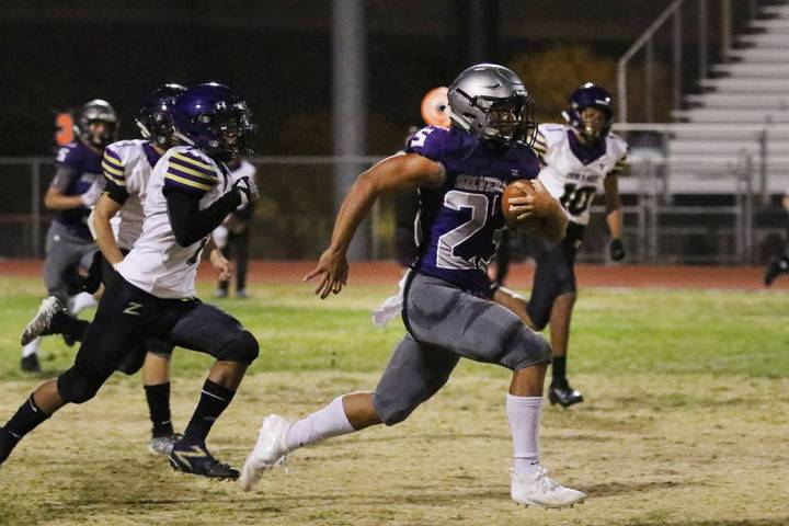 Silverado High's running back Breven Palpallatoc (23) runs for a 70-yard touchdown against Dura ...