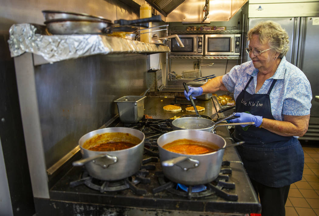 Pat Travis of the Little A'Le'Inn cooks breakfast for customers as usual and is preparing as mu ...