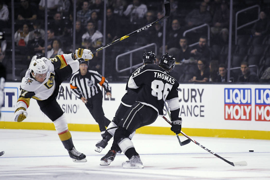 Vegas Golden Knights center Reid Duke, left, falls as Los Angeles Kings center Akil Thomas goes ...