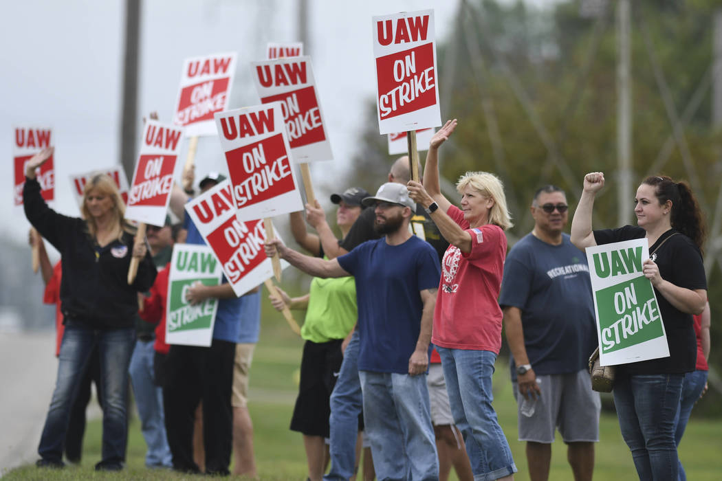 United Auto Workers members picket outside of the General Motors Lansing Delta Township plant M ...