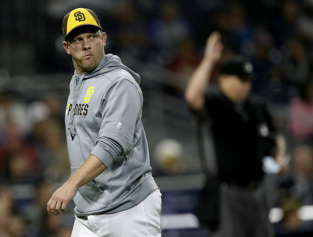 San Diego Padres manager Andy Green walks off the field during the eighth inning of the team's ...