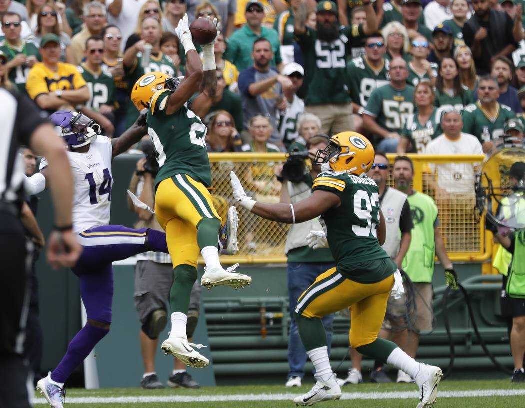 Green Bay Packers' Kevin King intercepts a pass intended for Minnesota Vikings' Stefon Diggs du ...