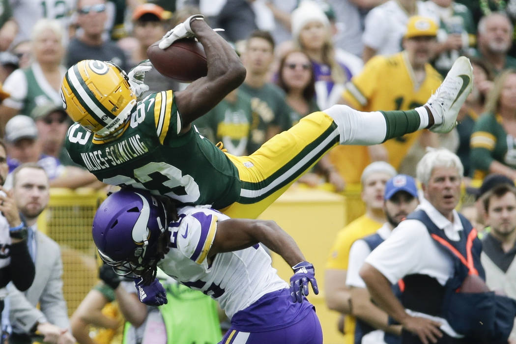 Minnesota Vikings' Trae Waynes breaks up a pass intended for Green Bay Packers' Marquez Valdes- ...