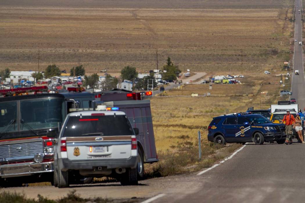 Emergency and medical personnel block off the Extraterrestrial Highway/State Route 375 for a po ...