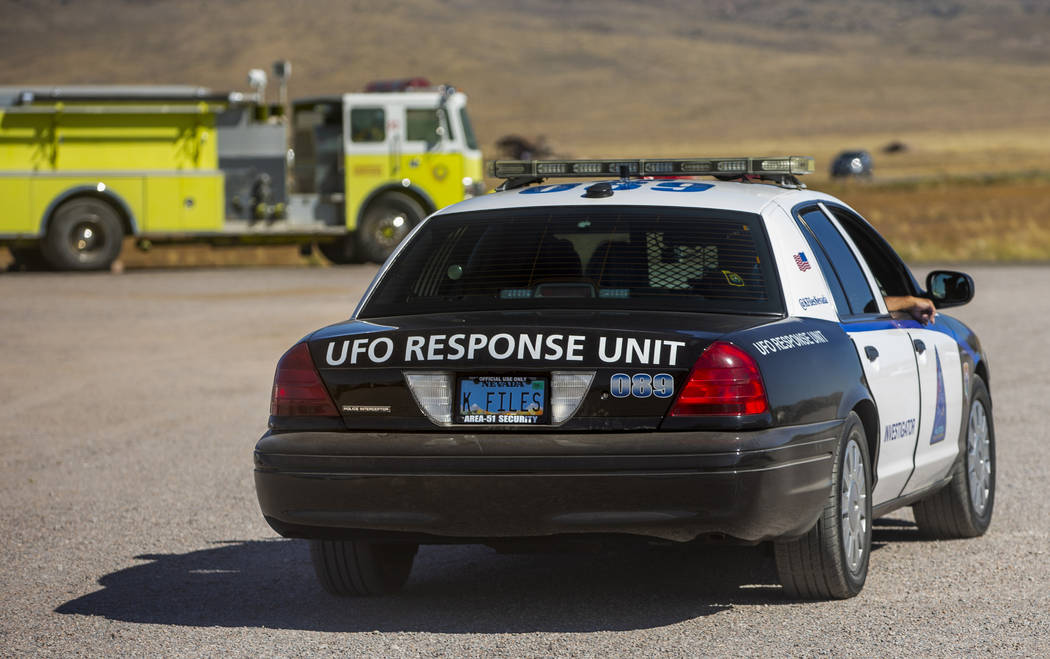 A UFO Response Unit makes their way up past the Little A'Le'Inn during the Alienstock festival ...