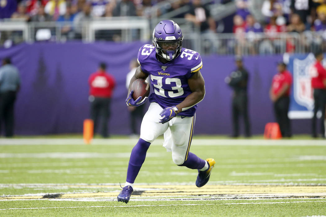 Minnesota Vikings running back Dalvin Cook runs up field during the first half of an NFL footba ...