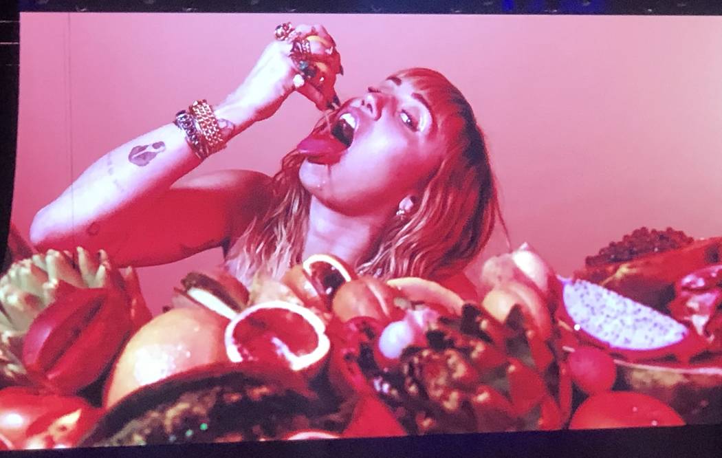 Miley Cyrus is shown in a video before her set at iHeartRadio Music Festival at T-Mobile Arena ...