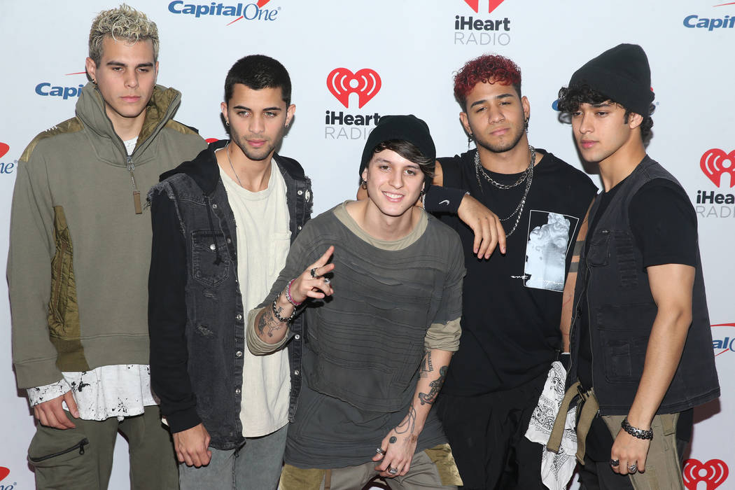 CNCO poses on the iHeartRadio red carpet at T-Mobile Arena in Las Vegas, Saturday, Sept. 21, 20 ...