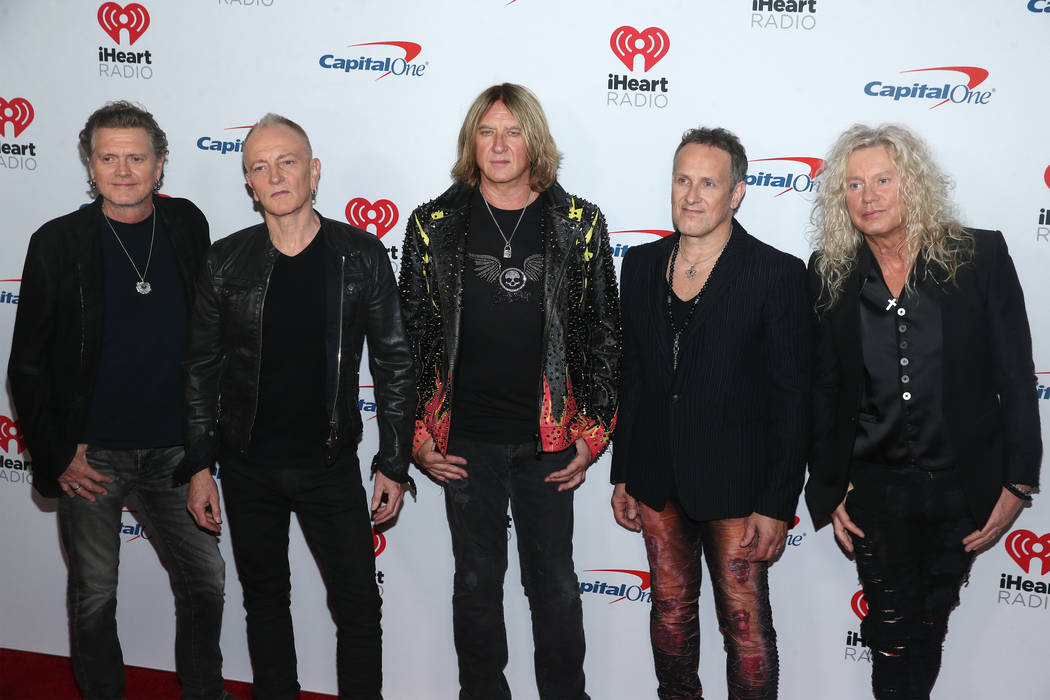 Def Leppard poses on the iHeartRadio red carpet at T-Mobile Arena in Las Vegas, Saturday, Sept. ...