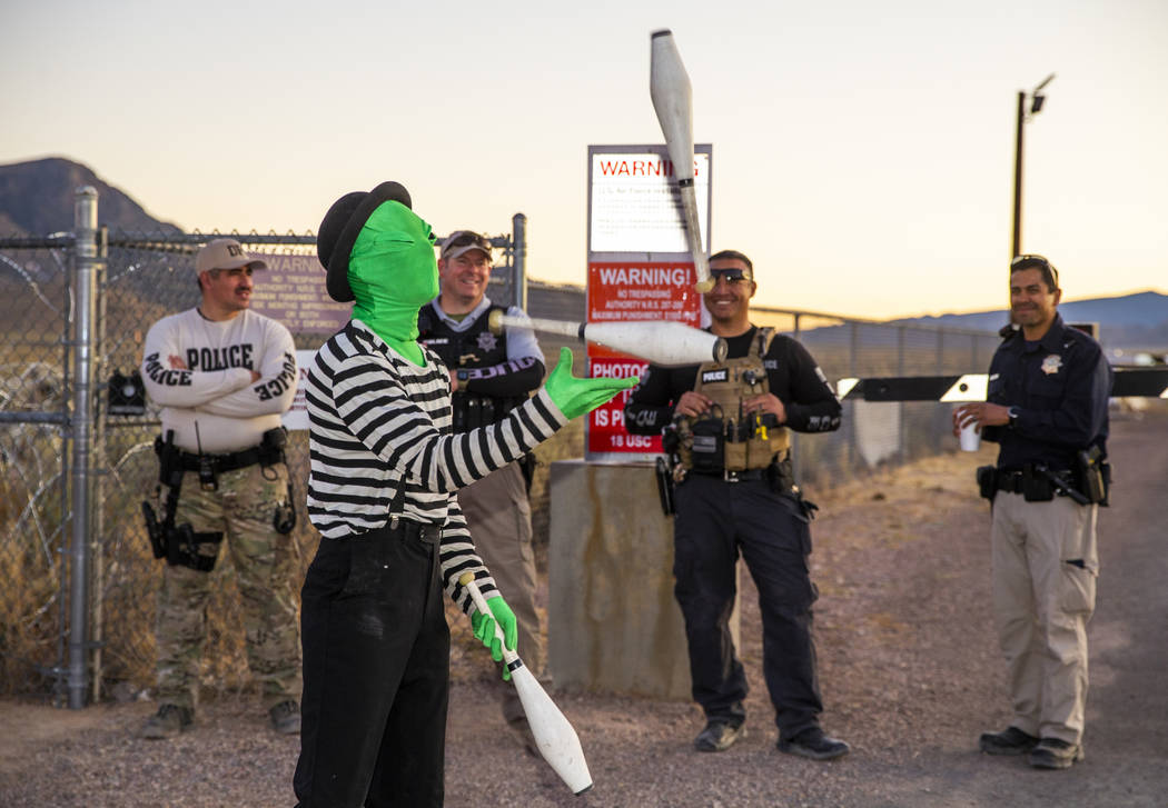 Scott Samford of Hollywood as an alien juggling mime entertains the security personnel at the b ...