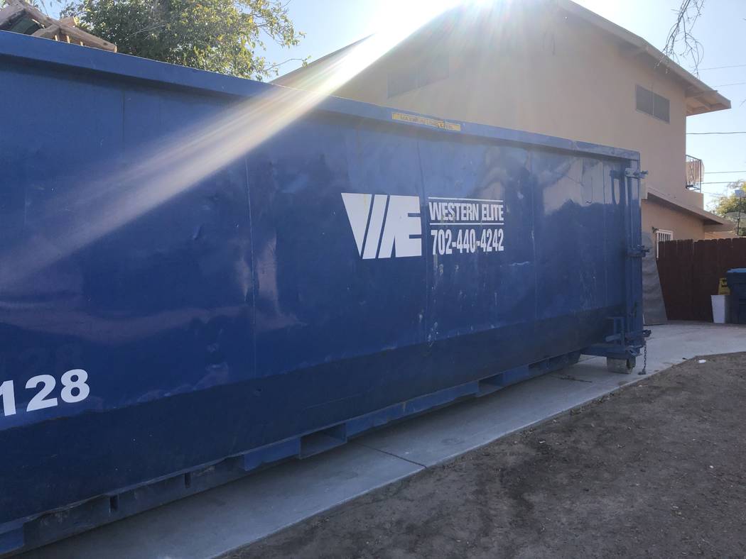 A blue dumpster sits in the driveway of 3105 Parkdale Avenue on Saturday, September 21, 2019. T ...