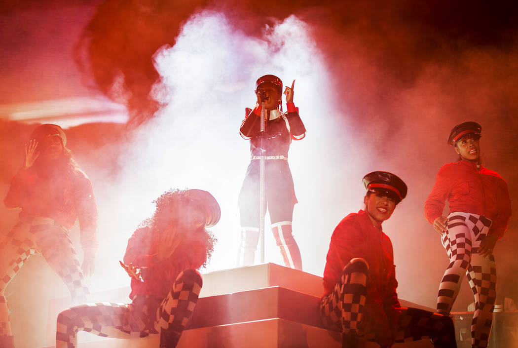 Janelle Monáe, top/middle, performs on the Bacardi Stage during the second day of Life is ...