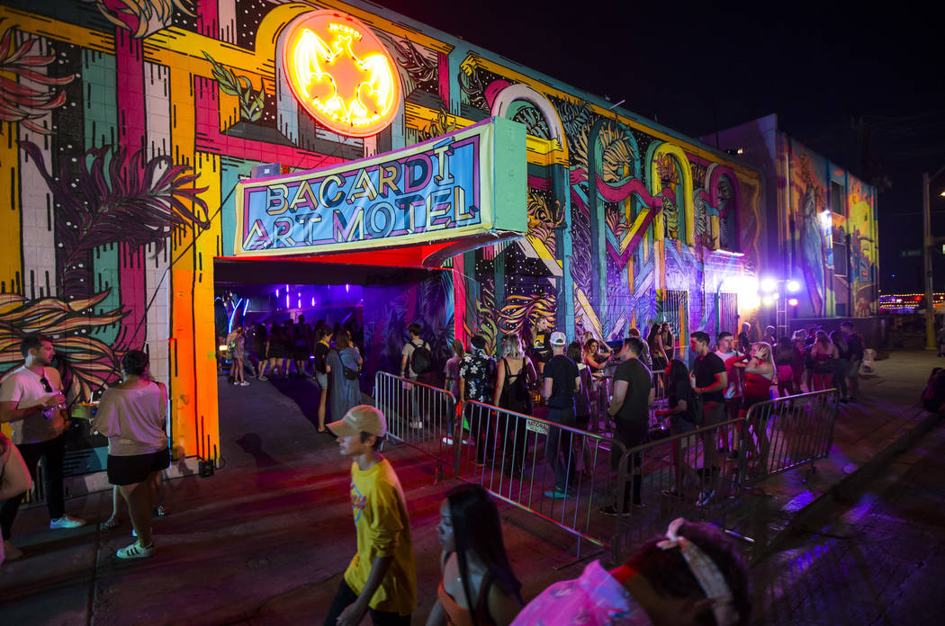 Attendees line up to get into the Bacardi Art Motel during day 2 of the Life is Beautiful festi ...