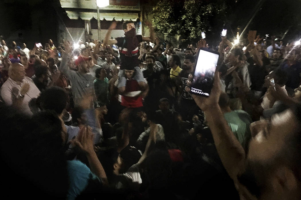 Protesters chant slogans against the regime in Cairo, Egypt, early Saturday, Sept. 21, 2019. Do ...