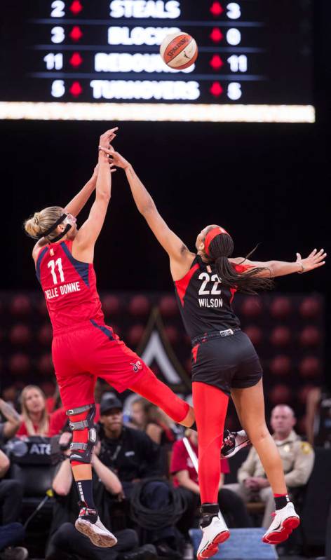 Las Vegas Aces center A'ja Wilson (22) defends Washington Mystics forward Elena Delle Donne (11 ...