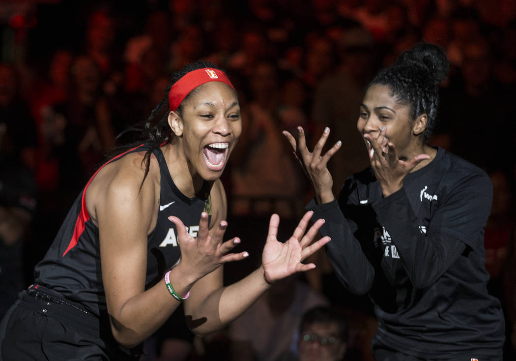 Las Vegas Aces center A'ja Wilson (22) gets fired up with teammate Sydney Colson (51) before th ...