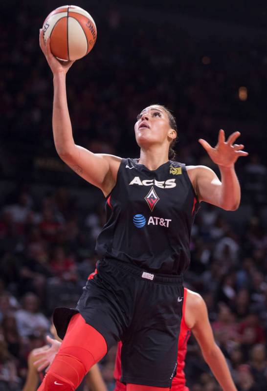 Las Vegas Aces center Liz Cambage (8) drives to the basket in the third quarter of Vegas' WNBA ...