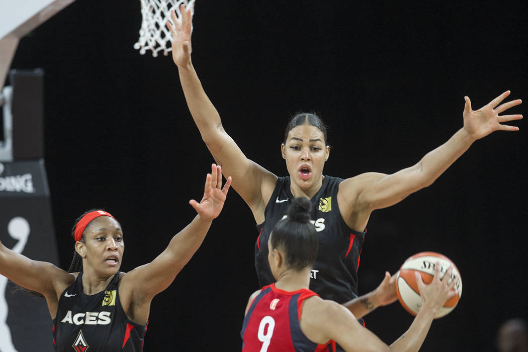 Las Vegas Aces center A'ja Wilson (22) and Las Vegas Aces center Liz Cambage (8) defend Washing ...