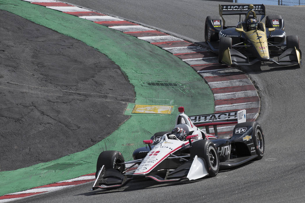 Josef Newgarden (2) leads Marcus Ericsson (7) down The Corkscrew during an IndyCar auto race at ...