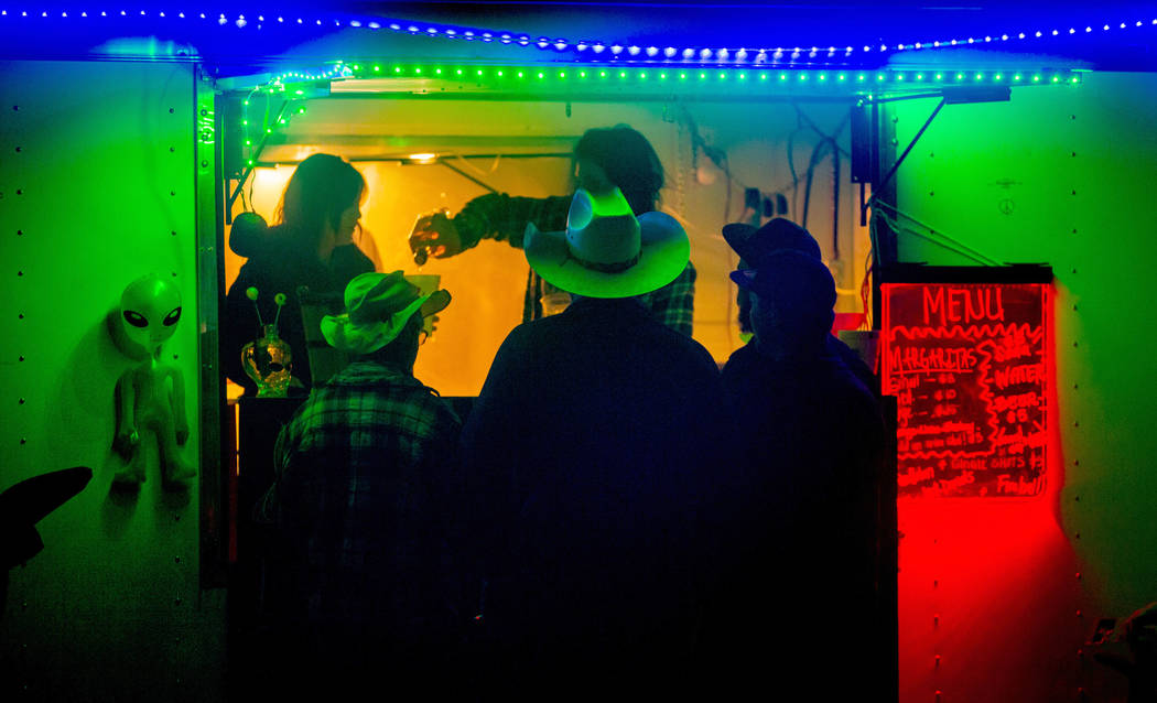Festivalgoers stop by for a fresh margarita from Pioche vendors during the Alienstock festival ...
