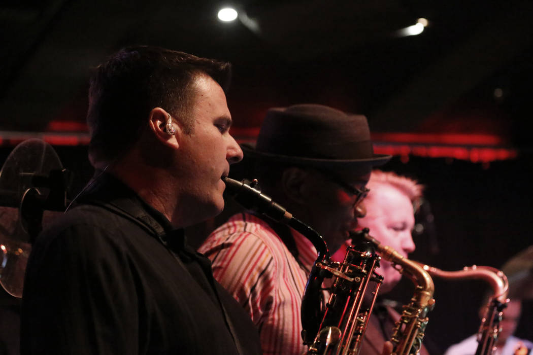 Eric Tewalt, member of the Santa Fe & The Fat City Horns, performs at the Copa Room in Las ...