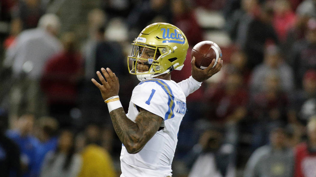 UCLA quarterback Dorian Thompson-Robinson (1) throws a pass during the second half of an NCAA c ...